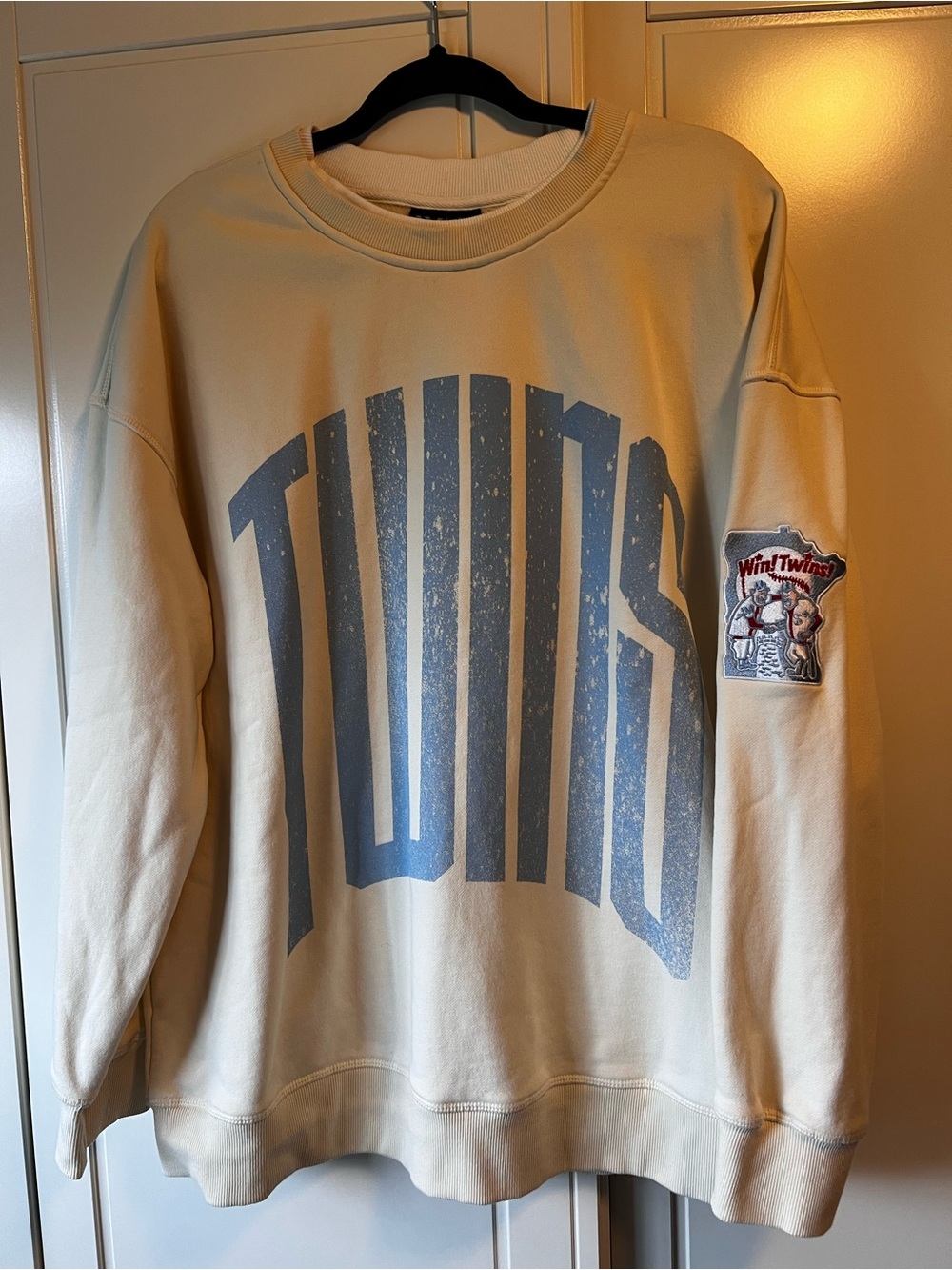 The Wild Collective Cream Crewneck Sweater with Blue 'TWINS' Graphic